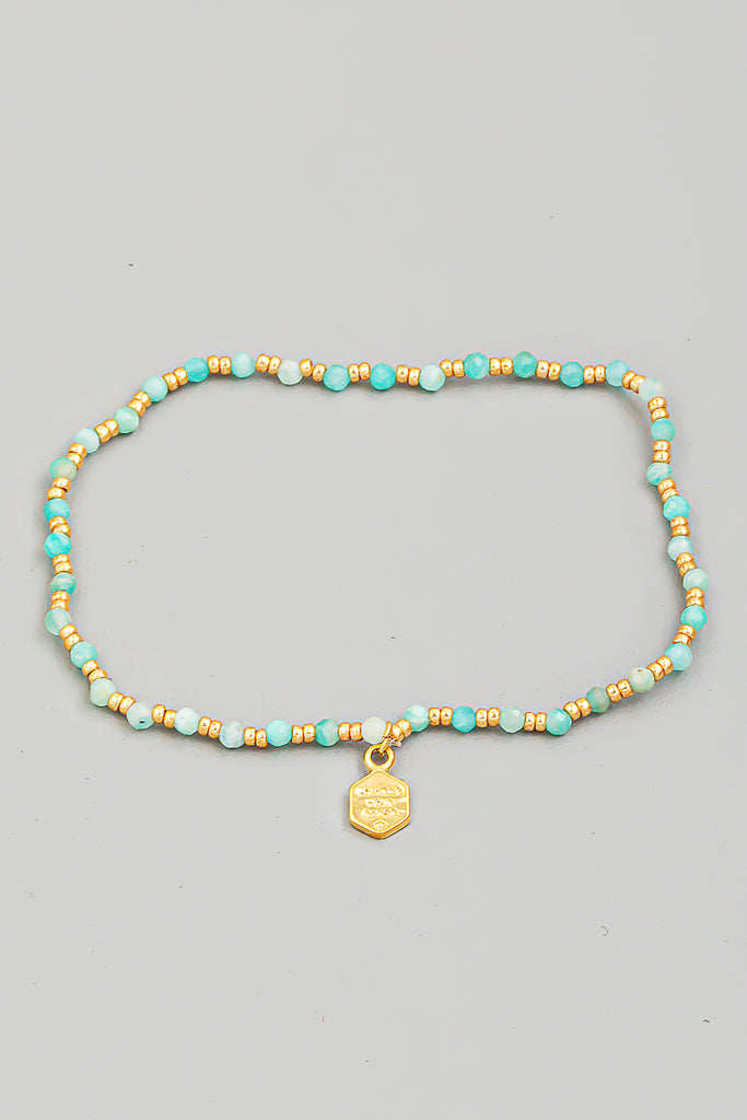 Delicate Beaded Bracelet In Brown With Charm In Blue/Gold Multi