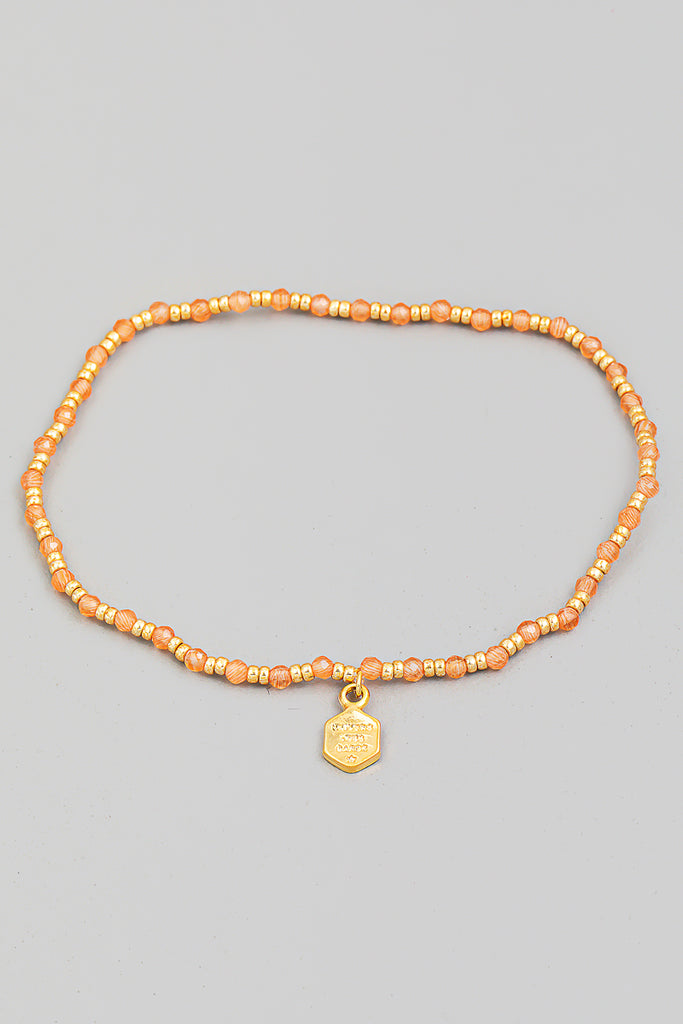 Delicate Beaded Bracelet In Brown With Charm In Pink/Gold Multi
