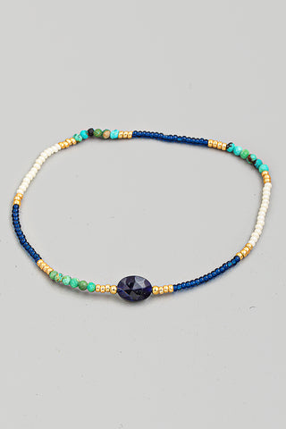 Delicate Beaded Bracelet In Brown With Charm In Blue/Gold Multi