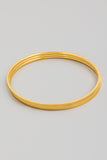 Three Separate Thin Bangles in Gold